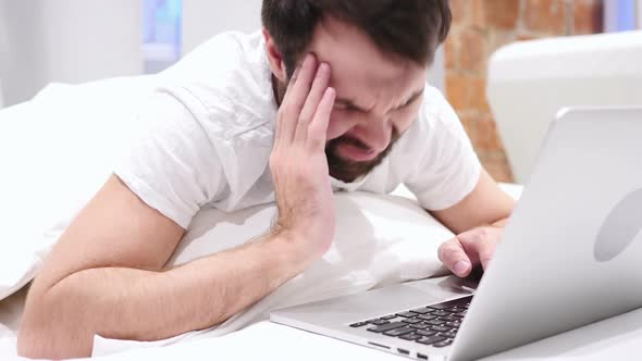 Headache Tired Beard Man Working on Laptop in Bed