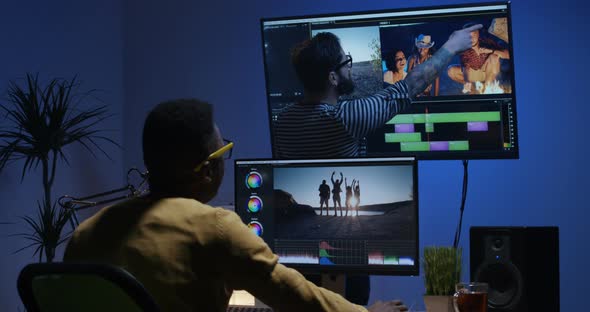 Young Man Editing Video Inside the Room