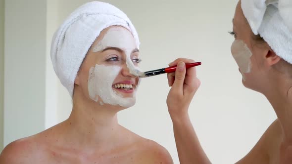 Beautiful Woman Having a Facial Treatment at Spa