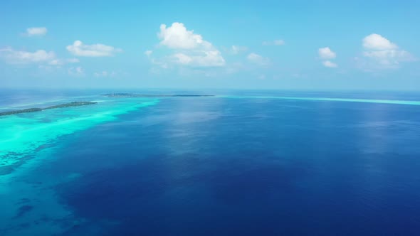 Aerial flying over texture of marine seashore beach journey by blue sea and white sand background of