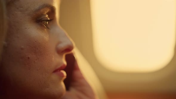 Beautiful Woman Chatting Phone at Porthole Closeup