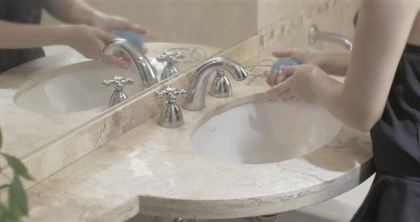 Hands of Beauty Woman Washing Her Hands Correctly at the Bathroom To Avoid Corona Virus COVID 19