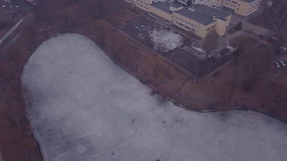 Drone Rises Above The Frozen Ice Of The Lake in Kyiv.