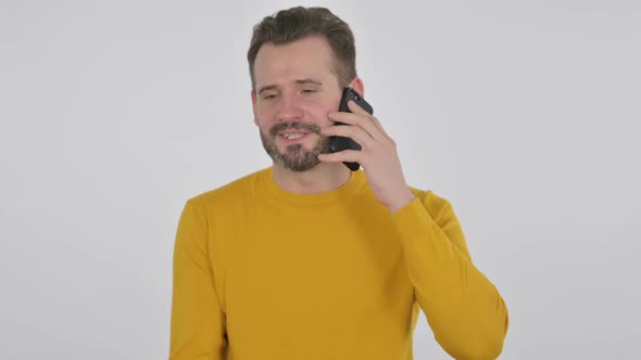 Portrait of Middle Aged Man Talking on Smartphone