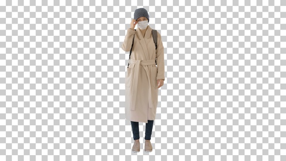 Girl in a medical face mask standing in a coat, Alpha Channel