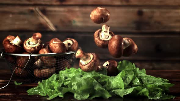 Super Slow Motion on the Lettuce Leaves Drop Mushrooms