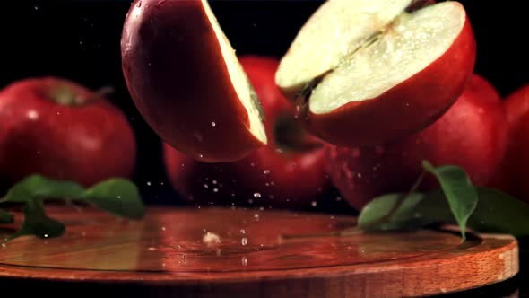 The Red Apple Falls on the Cutting Board and Splits Into Halves