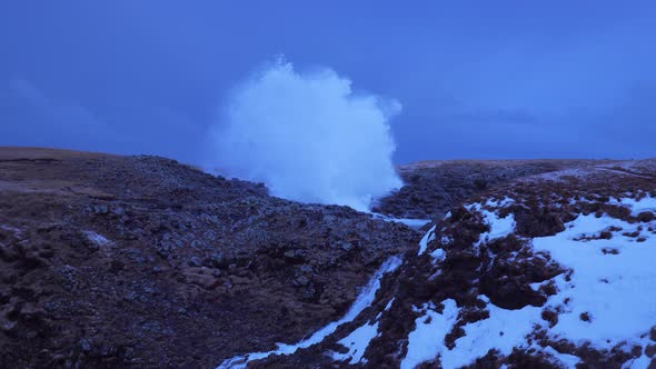 Iceland View Of Waterfall And Large Cave Blow Hole Erupting Ocean Water High In Arnarstapi 1