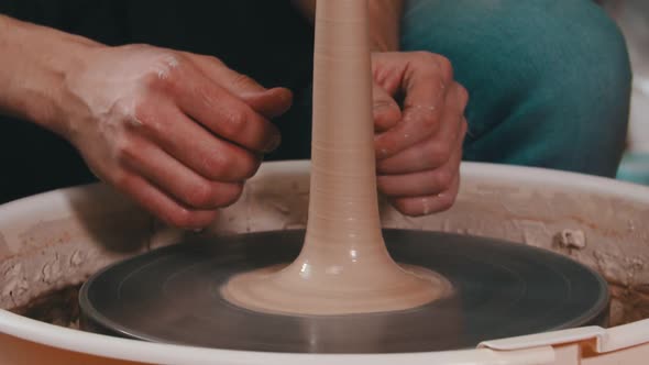 Clay Longer Figure Spinning on a Potter's Wheel