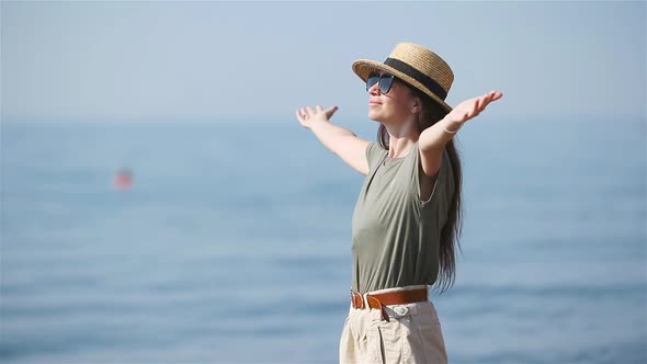 Young Beautiful Woman Having Fun on Tropical Seashore.