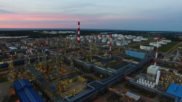 Aerial view of the petrochemical oil refinery plant shines at night