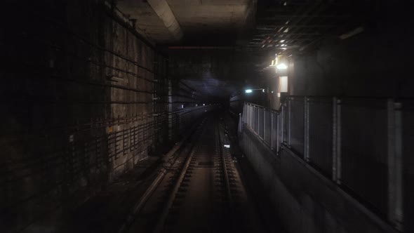 Subway Train Running Through the Tunnel. Train Traveling Through the Underground Tunnel, View From