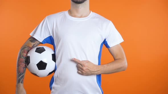 Close Shot Man Hand with Pointing Finger Follows Invisible Logo on Football Shirt