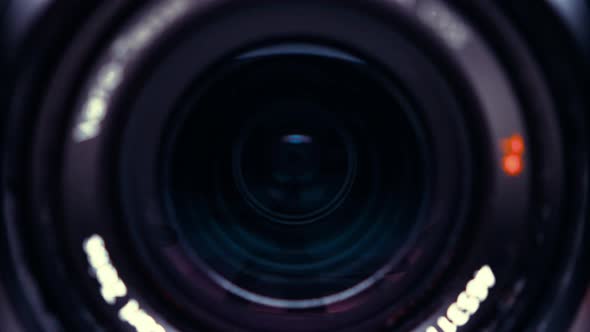 the lens of a movie camera or photo camera is shot in close-up