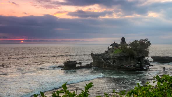 Zoom Out Shot of Tanah Lot Temple at Sunset Time. Bali, Indonesia