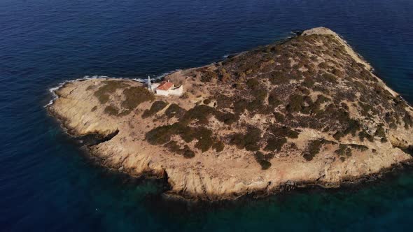 Small Island with Old House Surrounded By Sea Space