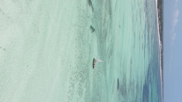 Vertical Video Boats in the Ocean Near the Coast of Zanzibar Tanzania Aerial View