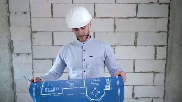 Construction engineer working with building plan