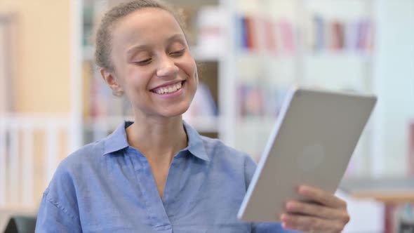 Portrait of African Woman Doing Video Call on Tablet