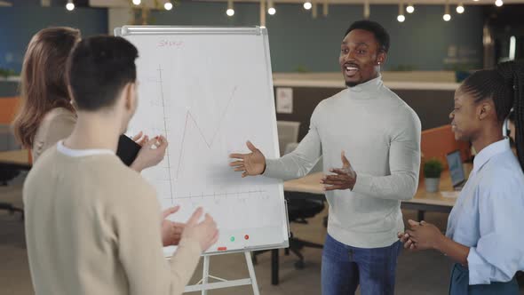 Business Audience Applauding Manager in Office