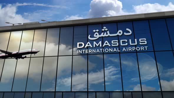 Airplane landing at Damascus Syria airport mirrored in terminal