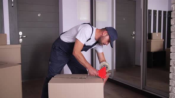 Worker Packing Removal Boxes with Adhesive Tape