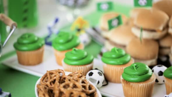 Kids football party set with snacks and drinks.