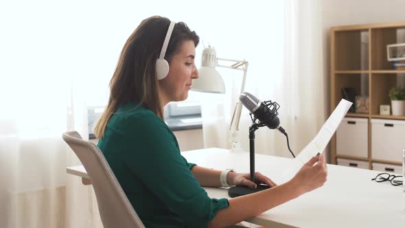 Woman with Microphone Recording Podcast at Studio