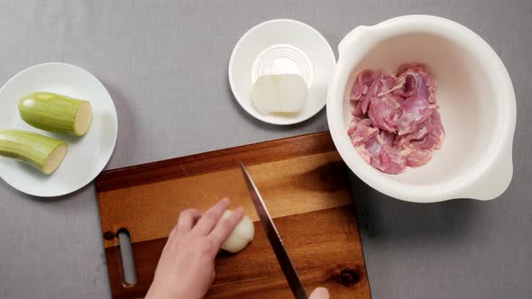 Woman Finely Chop the Onion