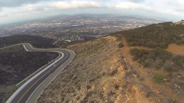 Aerial shot of road by mountain biking trail.