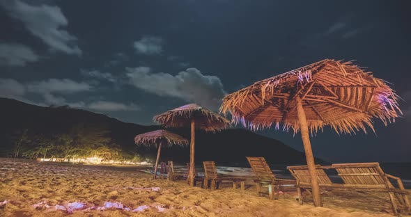 Timelapse Night Beach Umbrellas at Ocean Shore alt