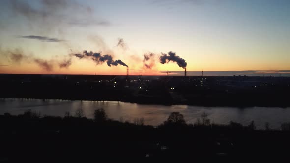  Smoking Stack in Sunrise. Air Pollution and Climate Change Theme. Poor Environment in the City