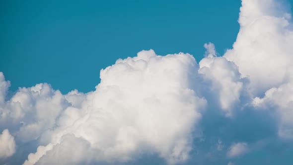 Timelapse of White Puffy Cumulus Clouds Forming on Summer Blue Sky