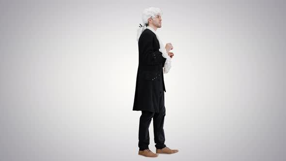 Man in Oldfashioned Laced Frock Coat and White Wig Thinking on Gradient Background