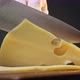 Person Cuts Expensive Cheese with Holes on Wooden Board - VideoHive Item for Sale