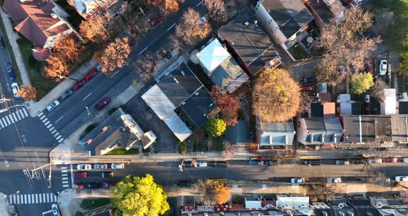 High aerial top down view of American urban city. Truck shot of quiet street in residential home hou