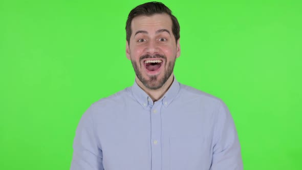 Portrait of Excited Man Celebrating Success Green Screen