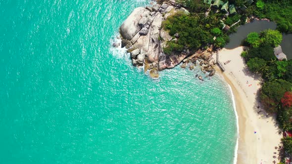 Aerial top down sky of beautiful coast beach break by shallow sea and white sand background of a pic
