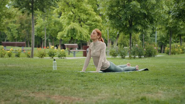 Yogi stretching outdoors.