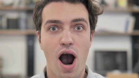 Close Up of Shocked Creative Man Wondering in Office