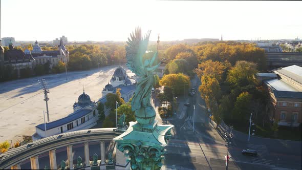 The archangel Gabriel atop its column in Heroes' Square