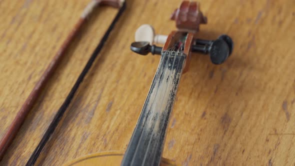 Antique Retro Classical Violin First Size on a Wooden Table