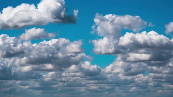 Cumulus Cirrus Clouds Move in the Blue Sky. Time Lapse.