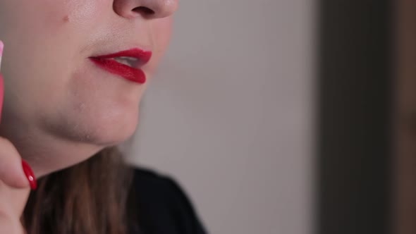 A Woman Smokes a Cigarette Closeup