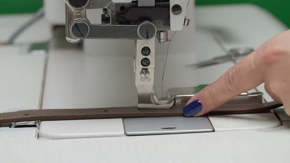 Sewing Machine Process While Stitching of Leather Detail Indoors