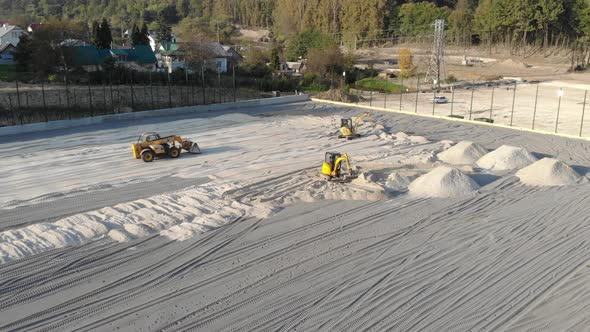 Excavators Level the Site with Sand, Moving Sand From the Mounds