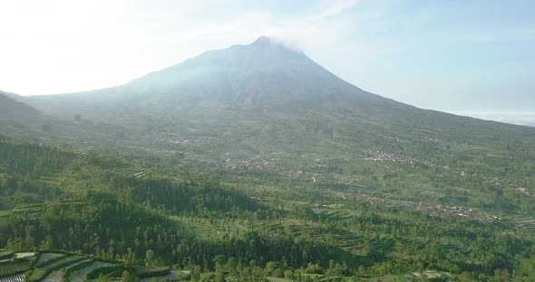 Merapi volcano with rural view of vegetable plantation and dense of trees, central java, Indonesia.