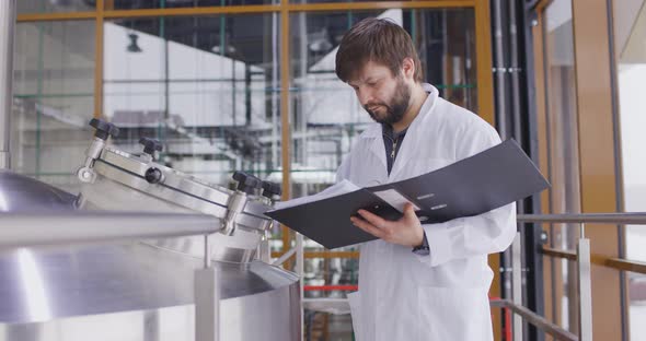 Caucasian Men Working at Brewery or Beer Factory