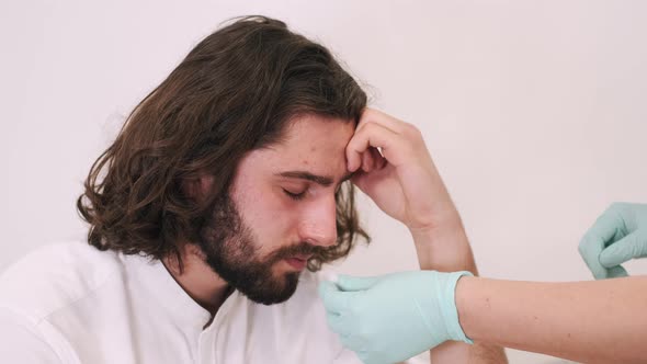 Young Man Feeling Bad Visiting Doctor in First Aid Concept