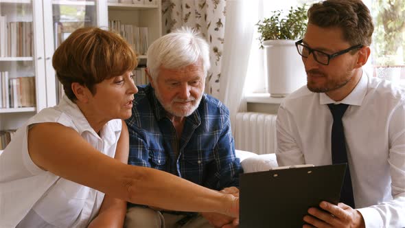 Senior couple planning their investments with financial advisor